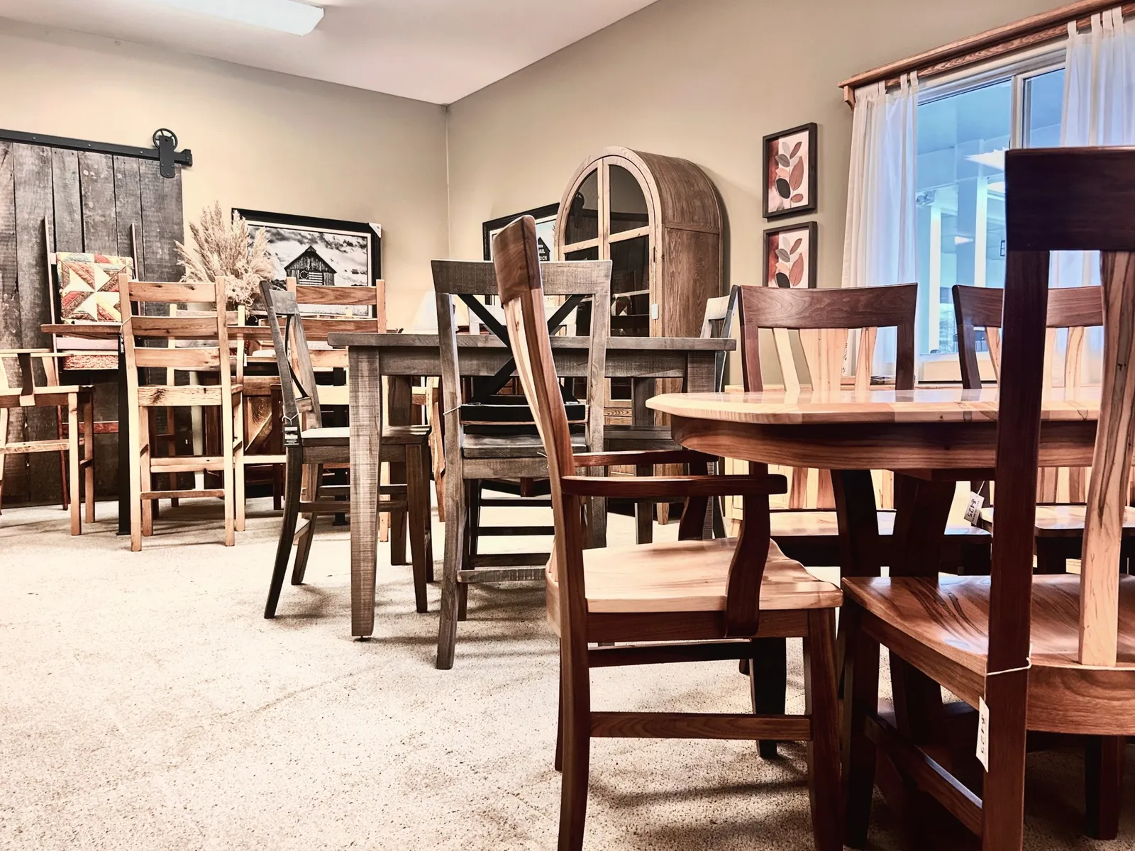 Solid wood dining tables and chairs in the Clear Creek Amish Furniture showroom