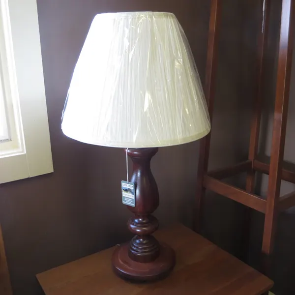 Lamp with turned base