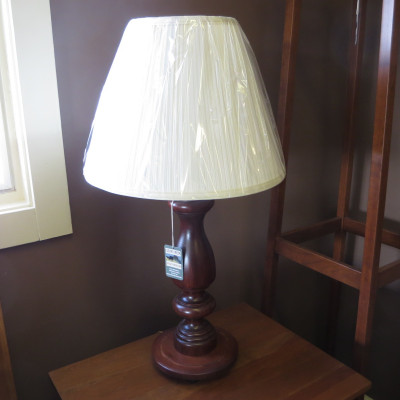 Lamp with turned base