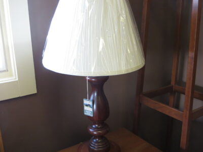 Lamp with turned base